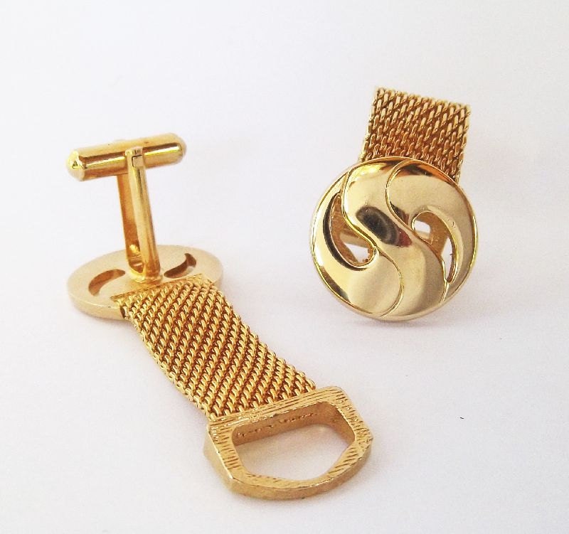 Unique set of wrap around cuff links in gold tone