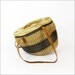 striped straw bag with leather cinch closure