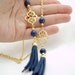 Matte Gold Plated Oriental Infinity Charm Lariat Necklace with Navy blue Lapis Lazuli Stones and Suede Leather Tassel