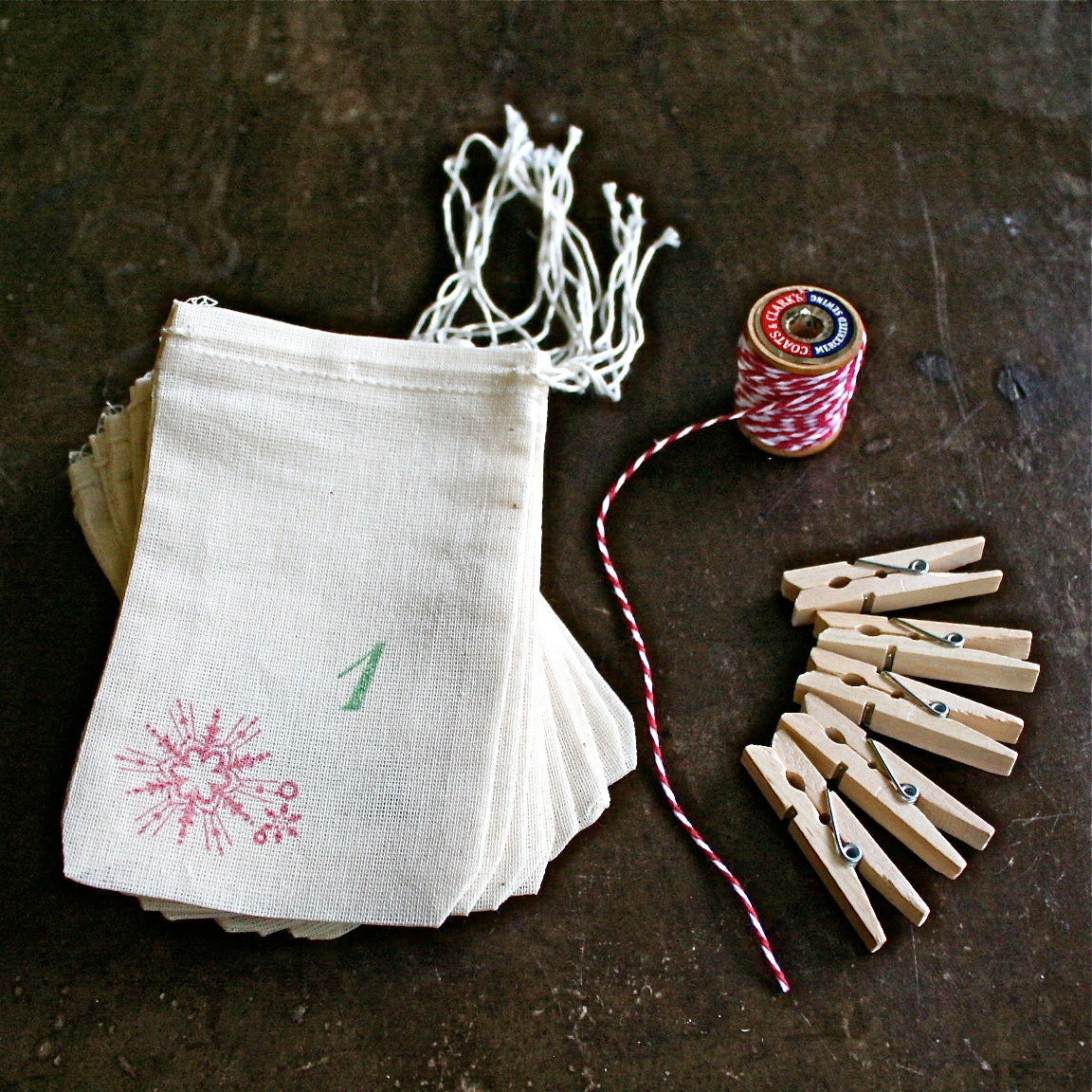 Advent calendar kit.  Muslin favor bags, 3x5.  Set of 24 in green and red, plus baker's twine and clothespins for display.