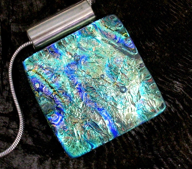 Every sparkling color in dichroic glass-- but not at once