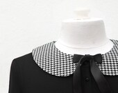 Houndstooth Peter Pan Collar. Detachable Peter Pan Collar in black and white check pattern with black ribbon bow.