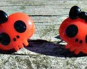 Kawaii Cute Head Skull Earrings. Red skull studs with black bows.