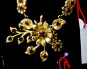 Vintage 1950's Gold Tone Flower Filigree Necklace with Prong Set  Deep Red Crystal Rhinestones