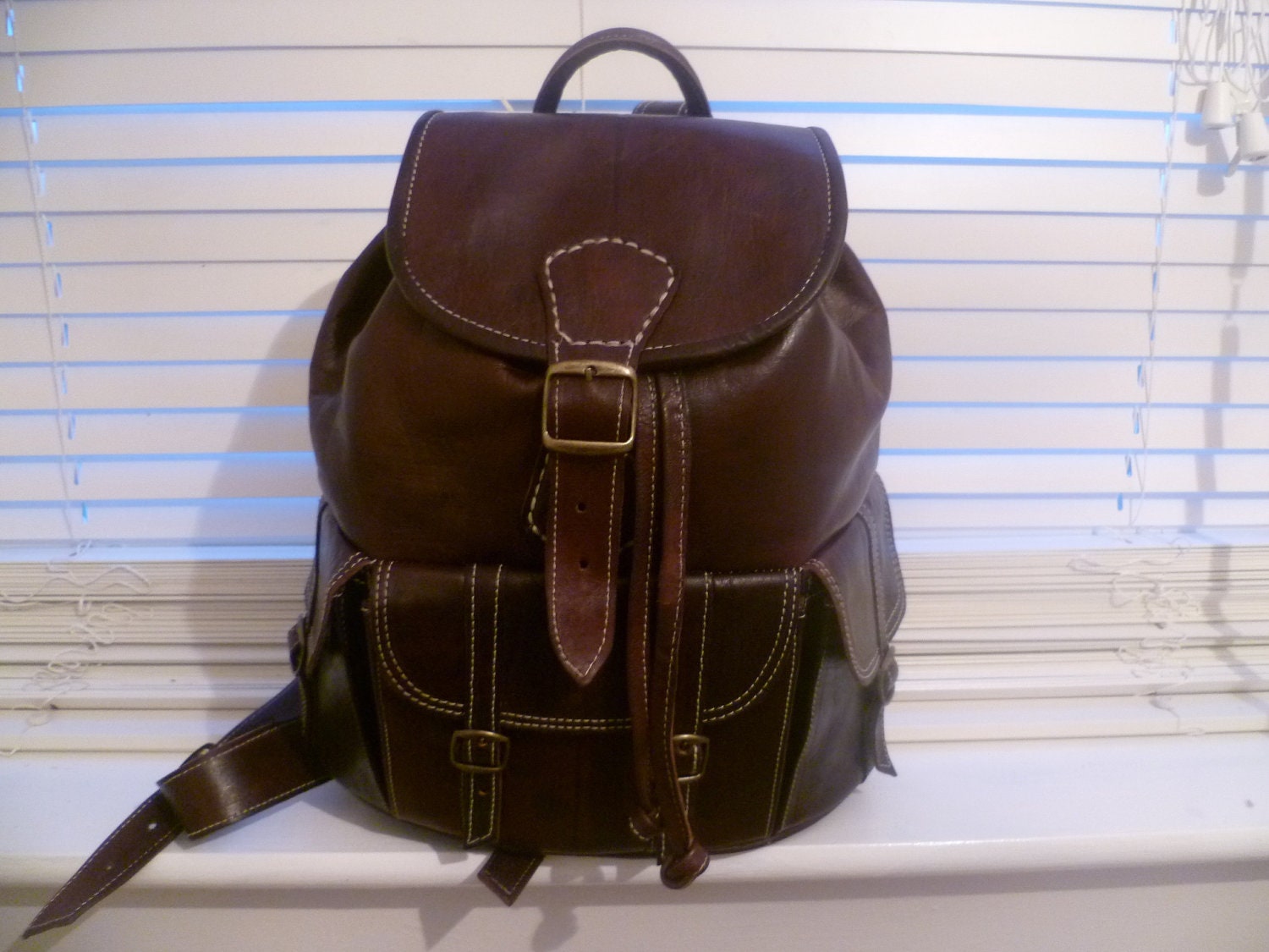 Sale was 75.00 pounds now 65.00 pounds brown leather backpack Unisex