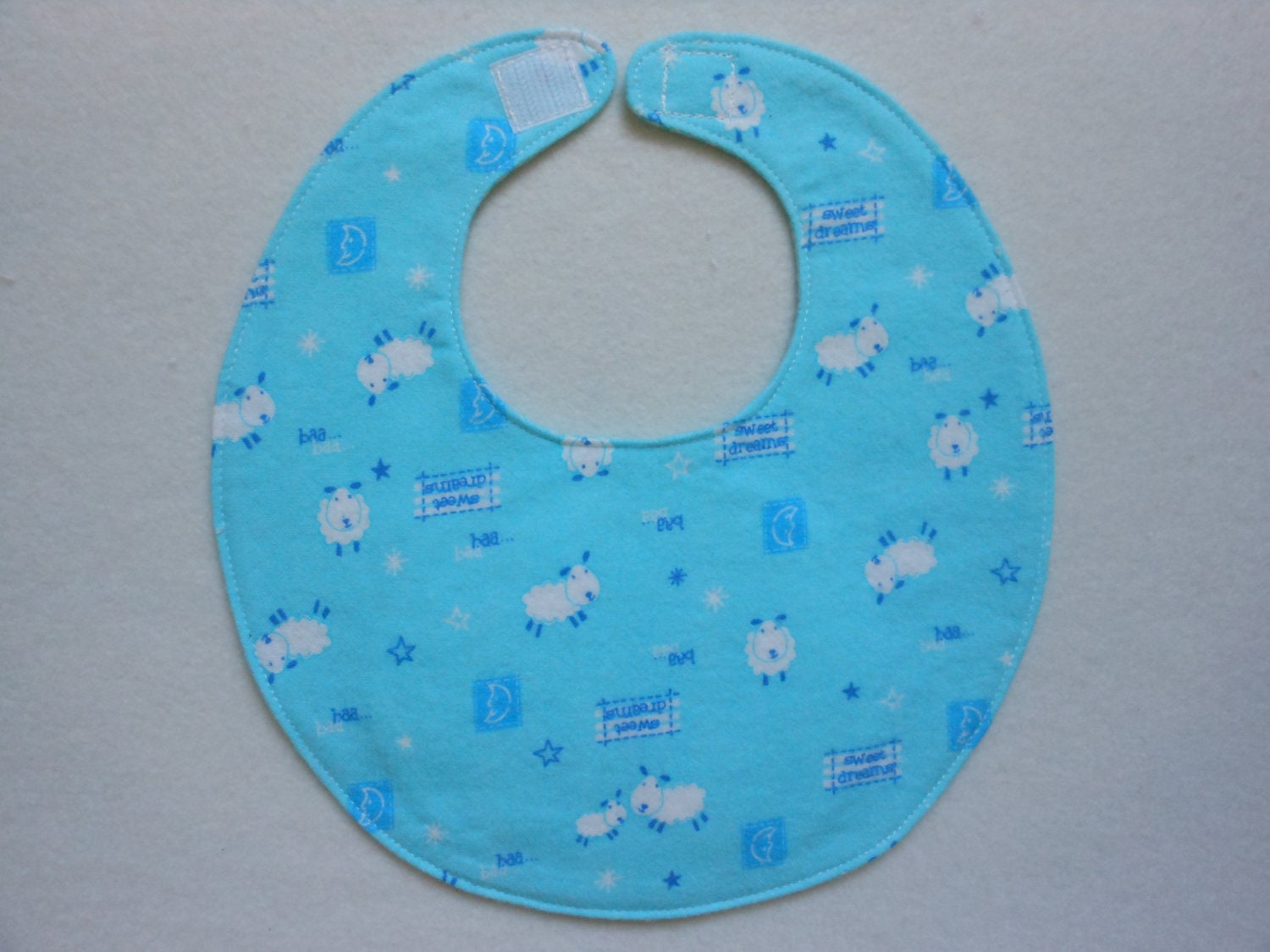 Baby Bibs, four soft layers, reversible, bright aqua blue, with little white lambs