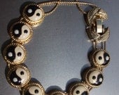 Gold toned Enameled Yin Yang Slide Bracelet