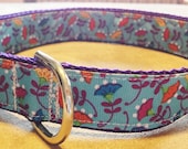 1 inch wide adjustable side release dog collar - colorful flowers on turquoise - purple webbing - size medium
