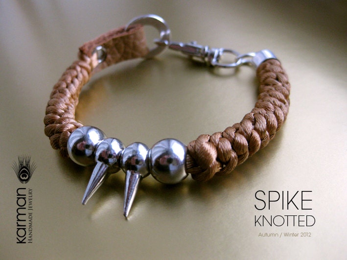Spike Bracelet. Silk knotted bracelet with leather details and silver metal spikes.