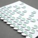 3D cut and folded scattered hearts greeting card, white with mint insert