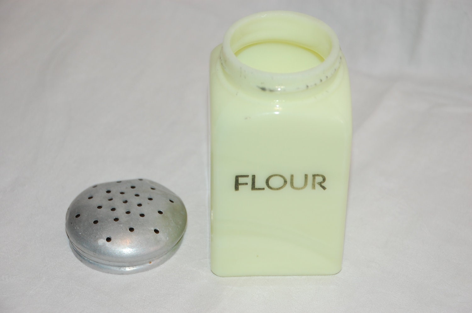 Vintage McKee Seville Yellow Flour range shaker with original lid and block letters