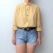 Vintage pastel yellow dot blouse with peter pan collar