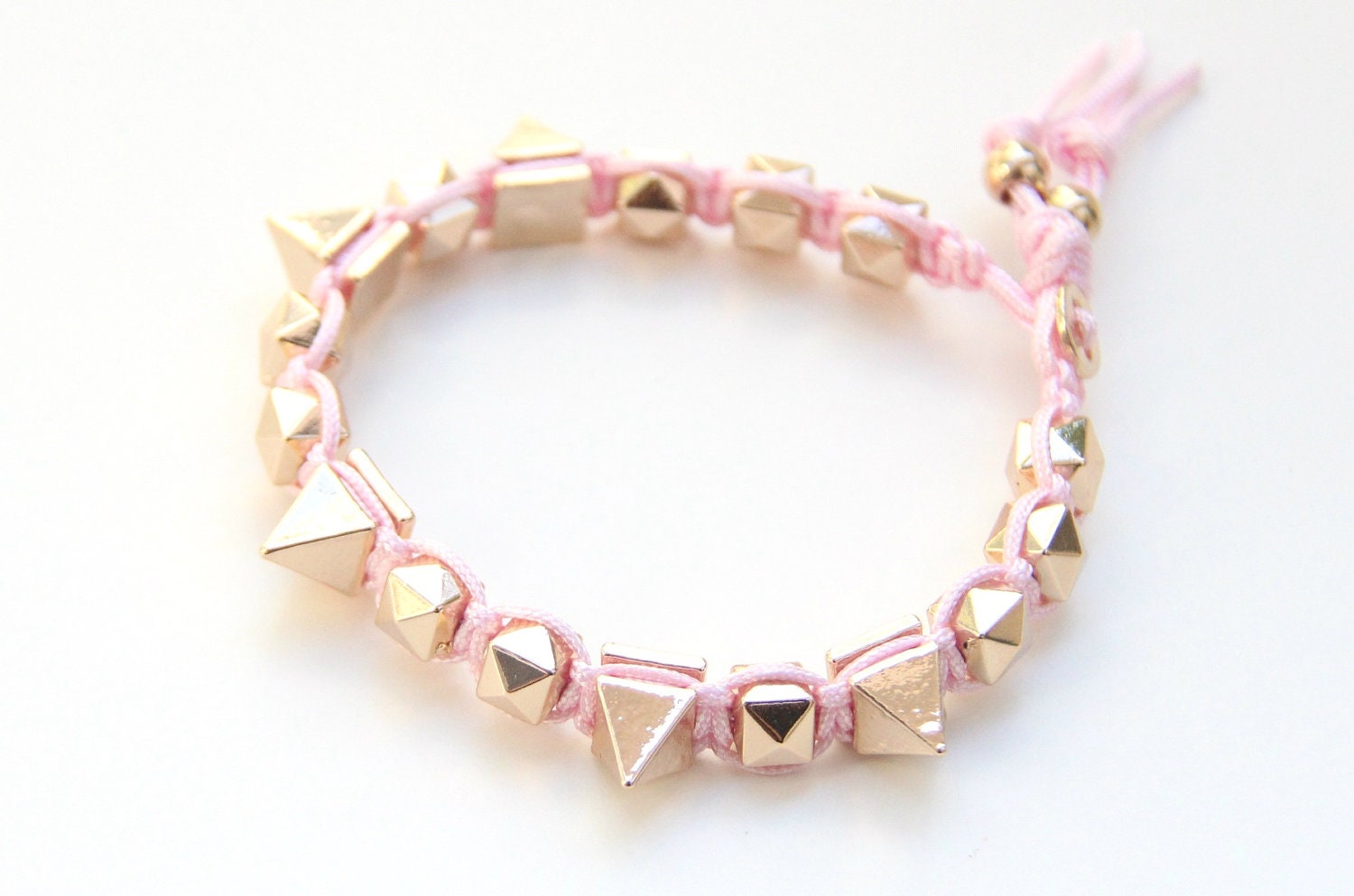 Arm candy - Gold Spikes beads and Pink rose cord - woven bracelet