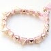 Arm candy - Gold Spikes beads and Pink rose cord - woven bracelet