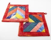 Fabric Hot Pads, Quilted Pot Holders - Chevron Strip Pieced with Tomato Orange Hand Dyed Cotton