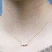 trio star necklace in gold