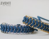 Navy blue chevron bracelet with silver and gold chain.