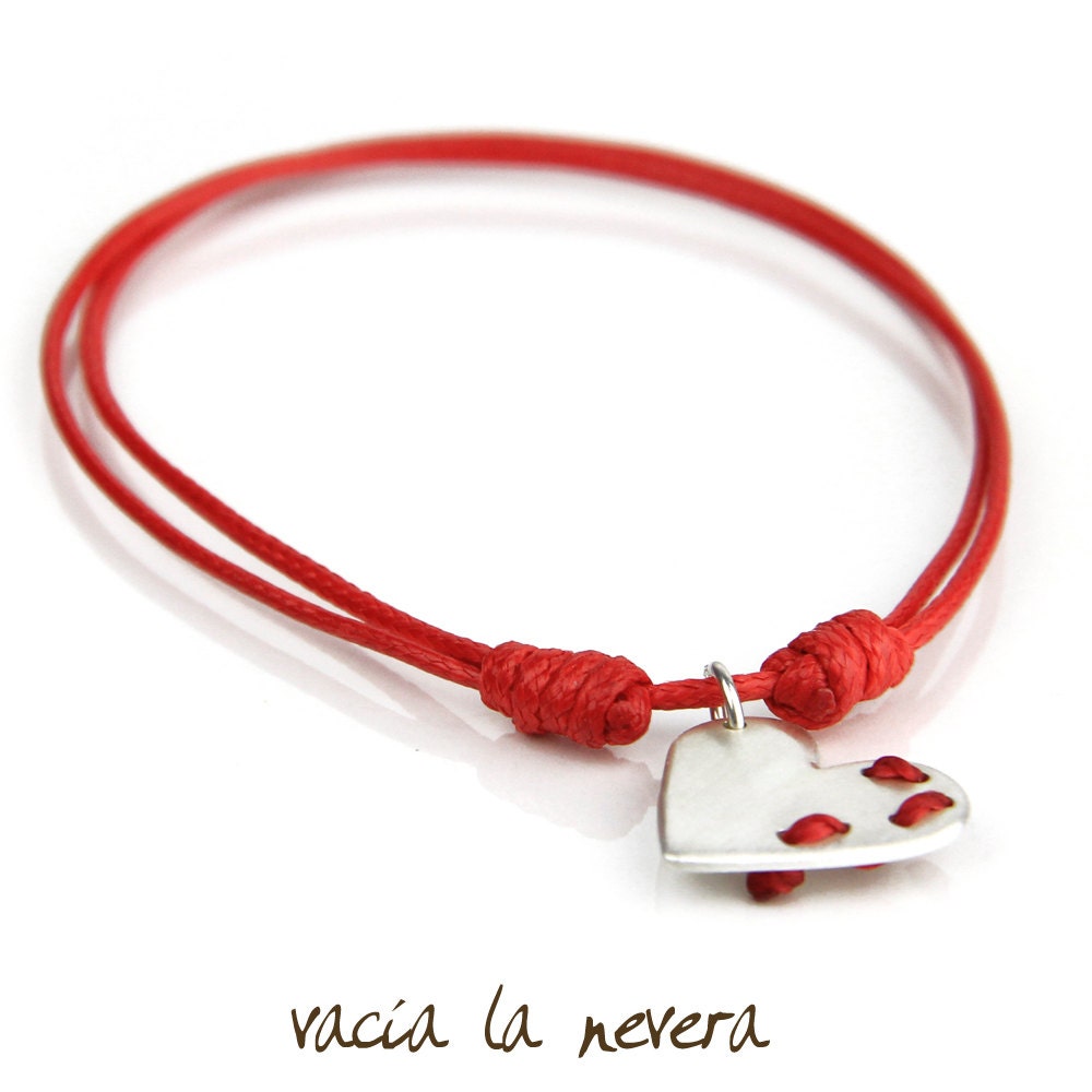 Sterling Silver Bracelet. Heart shape. Sewn with a Red Cotton. Adjustable. Handmade by Vacia la Nevera.