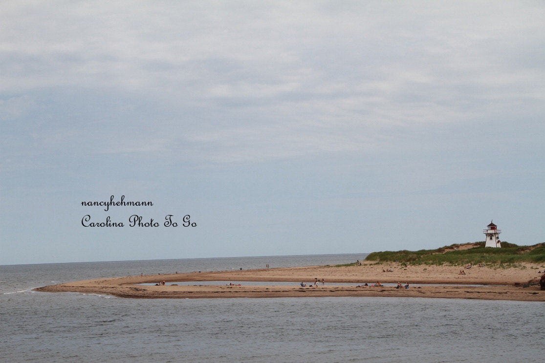 Art photography of a lighthouse on the coast of Prince Edward Island, Canada, beach, ocean