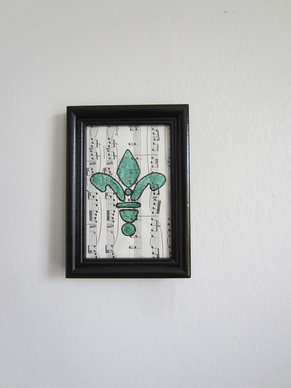 4x6 green fleur de lis framed painting on sheet music