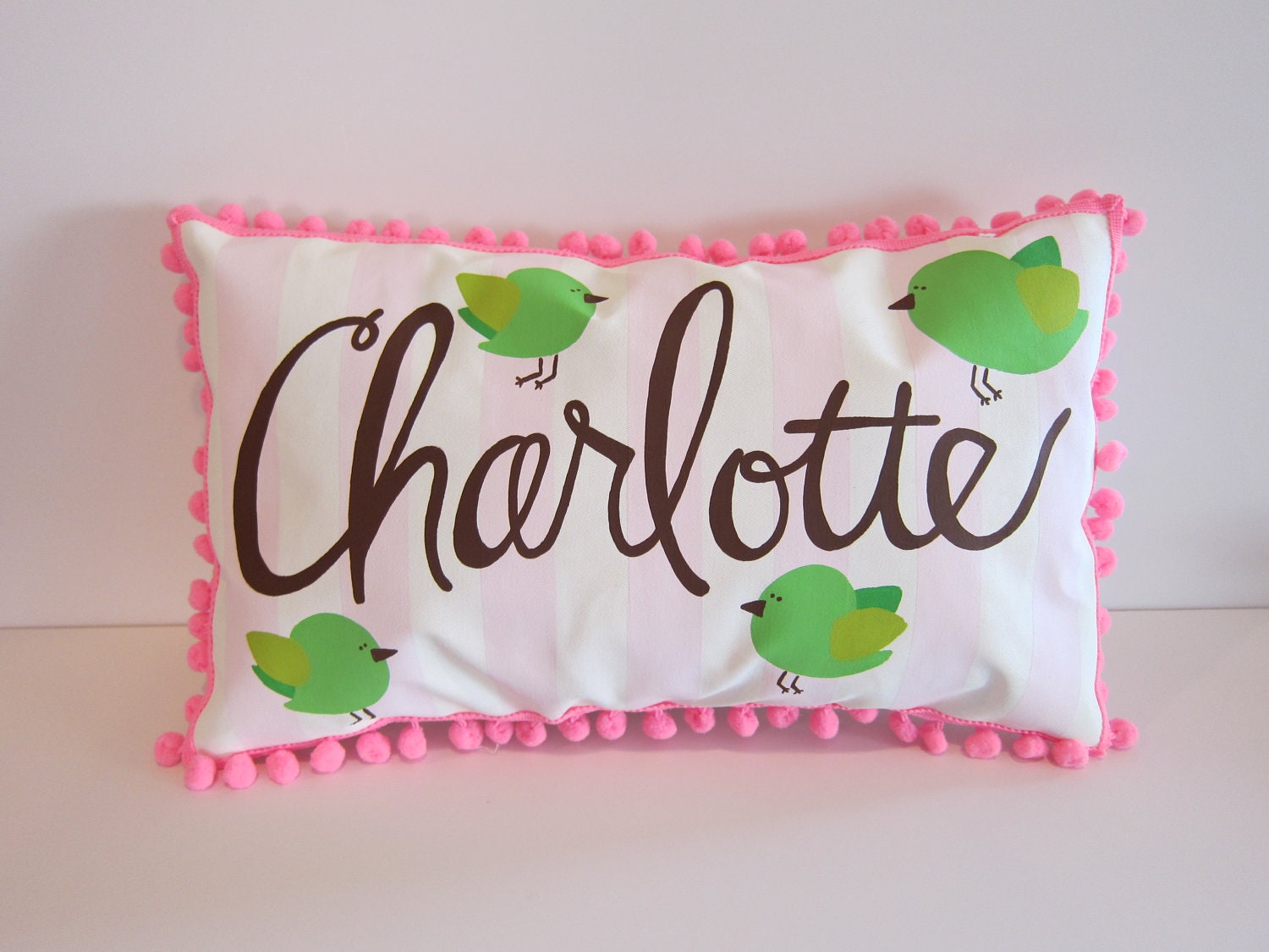 Personalized baby pillow with pink stripes and baby birds. Name in chocolate brown.