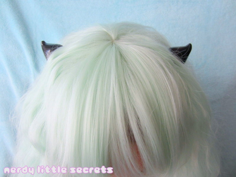 http://www.etsy.com/listing/116431082/pastel-goth-horn-hair-clips?ref=shop_home_active_15