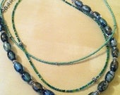 Multi-strand beaded green necklace
