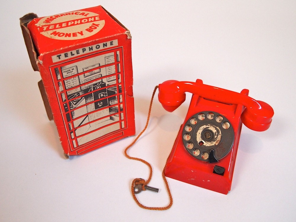 Vintage rare and unique mechanical red rotary dial telephone money box toy collectible in original box