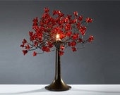 Table light. Red flowers.