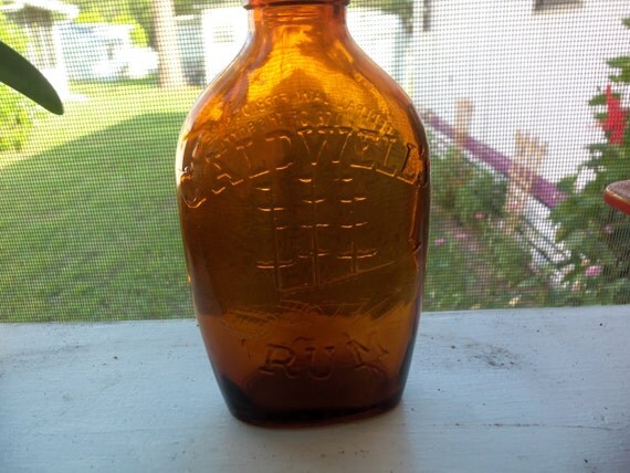 Vintage Amber Caldwells Rum bottle with cap by TimsTreasureChest