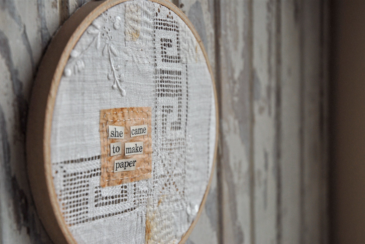 she made paper - vintage linen, embroidered, mended, make do art