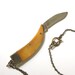 Genuine Amber Bone Claw Pendant Necklace with a Hidden Folding Knife Blade