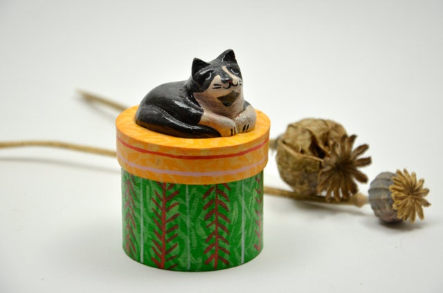 Round wooden trinket / treats box with a sleeping cat on top