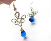 Wired Elegance - wire wrapped earrings, blue teardrop glass bead
