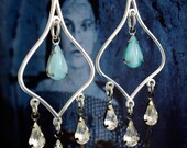 moroccan boho chandelier earrings. with turquoise blue vintage glass teardrops.