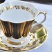 Vintage Queen Anne Tea Cup and Saucer, Glowing Black and Gilt, England