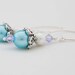 Pastel Blue Glass pearlised Earrings With Sparkling Pale Blue Swarovski Crystal And Silver Bead