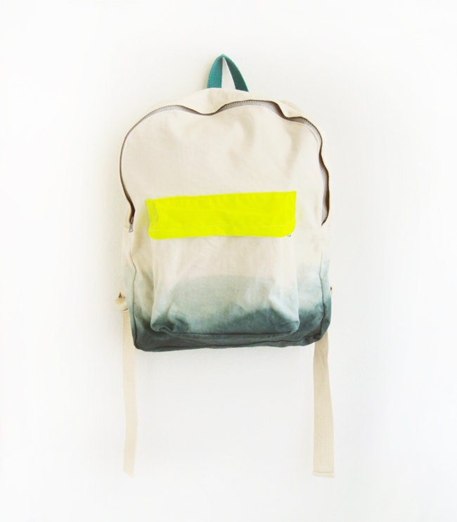 forest green backpack with neon yellow pouch