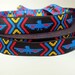 3 yards THUNDERBIRD Jacquard trim. Turquoise, red, yellow on black. 1 inch wide. 275-B
