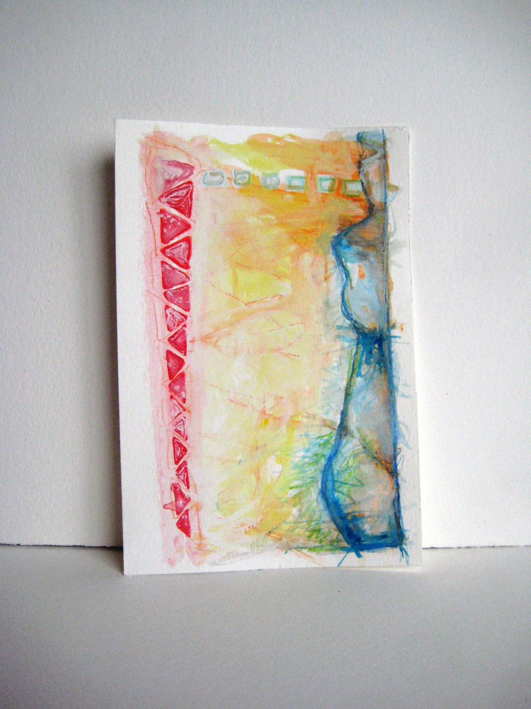 Red Triangles and blue figure on 6 x 9 drawing on heavy watercolor paper