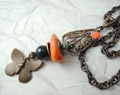Butterfly dangle on brass chain Necklace with orange disc bead