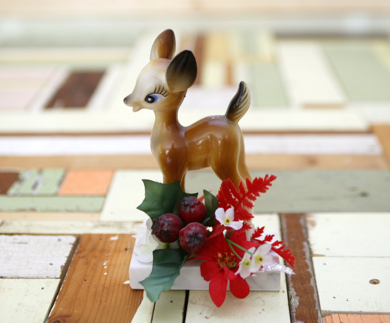 Holiday deer figurine with holly