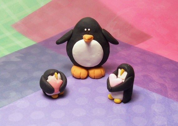 3 Handmade Polymer clay penguins set 2 holding by kittynowchow