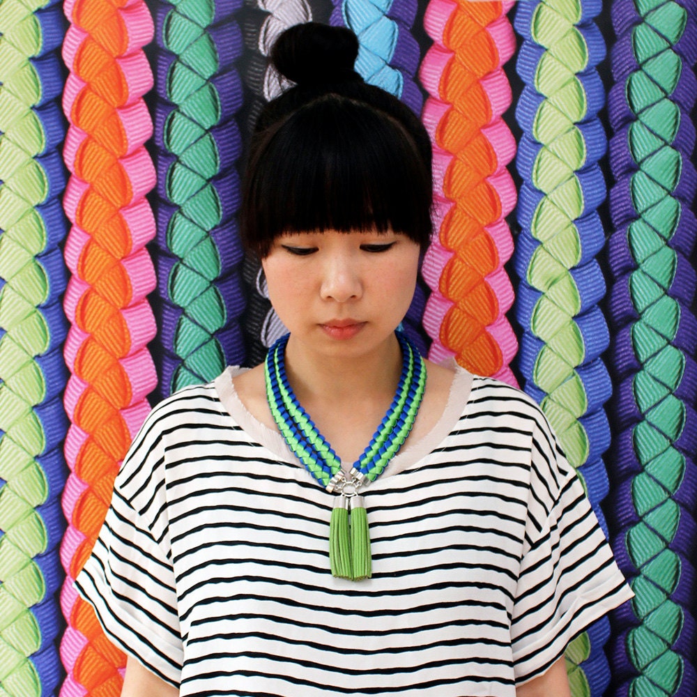 The Margot double braided grosgrain necklace with leather tassels in lime green and blue