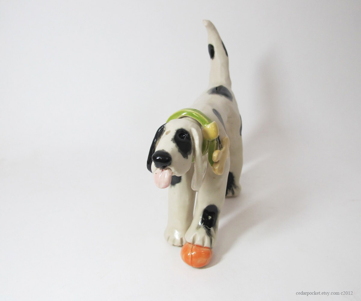 Polka Dot Ceramic Dog Sculpture with a pumpkin or a basketball