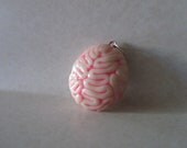 Glow in the dark brain pendant black light responsive