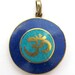 Attractive Om pendant with lapis and turquoise inlay