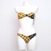 Reserved for Julia NOS Vintage bikini gold black 80s Size XS