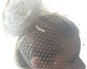 Alluring Petals pearls-accented bridal birdcage veil with handmade flower fascinator