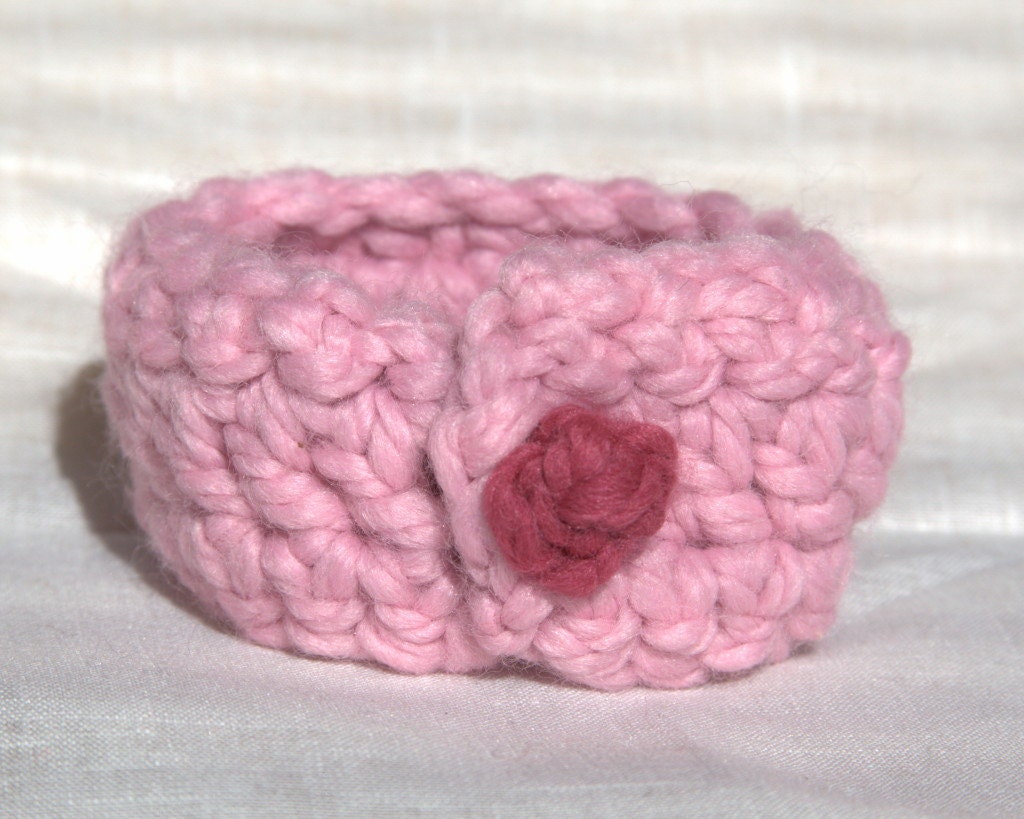 Pink wrist cuff with raspberry bauble